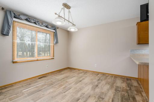 Bright and inviting dining area with large window.