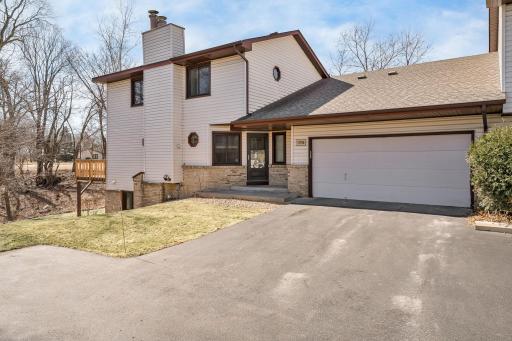 Welcome home! This well-maintained end-unit townhome features charming curb appeal, a spacious driveway, and a two-car garage.