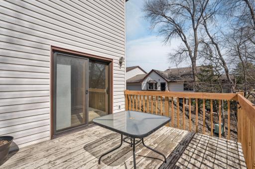 Convenient access from the sunroom/dining area to the deck—ideal for seamless indoor-outdoor living and weekend grilling.