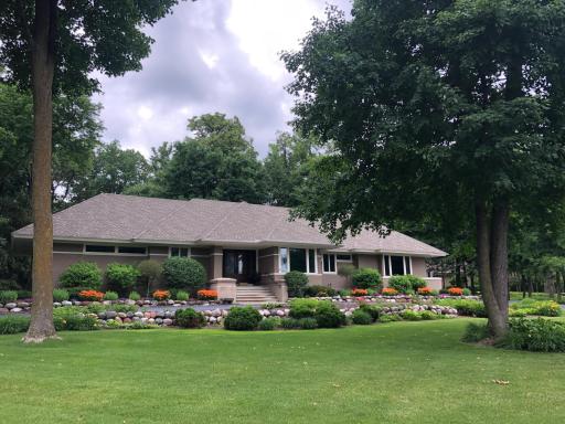 This exquisite custom-built home is located on a private, 0.65-acre wooded cul-de-sac lot