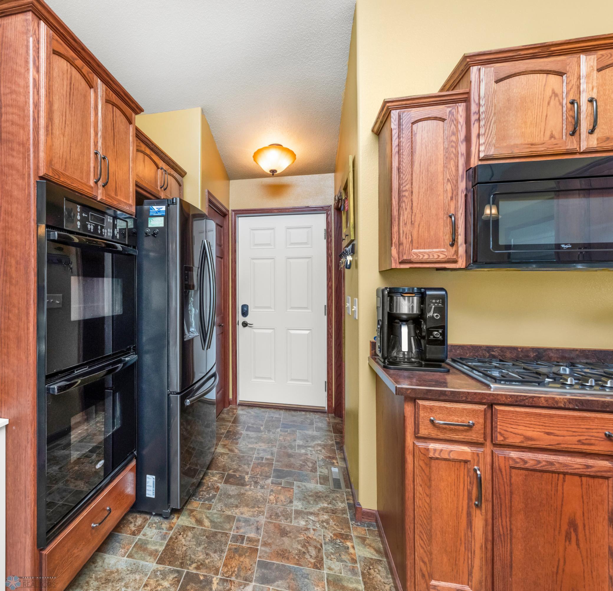 Kitchen view 3-access to garage & laundry