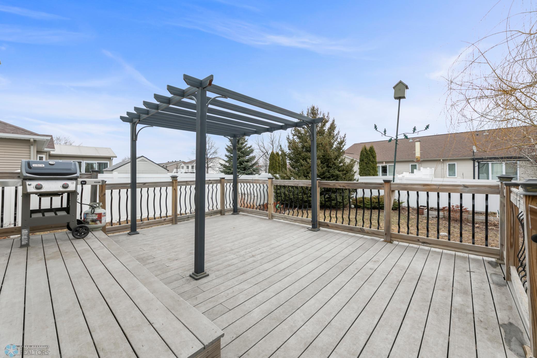 Deck - view 1 maint free decking, iron spindles and wood posts.