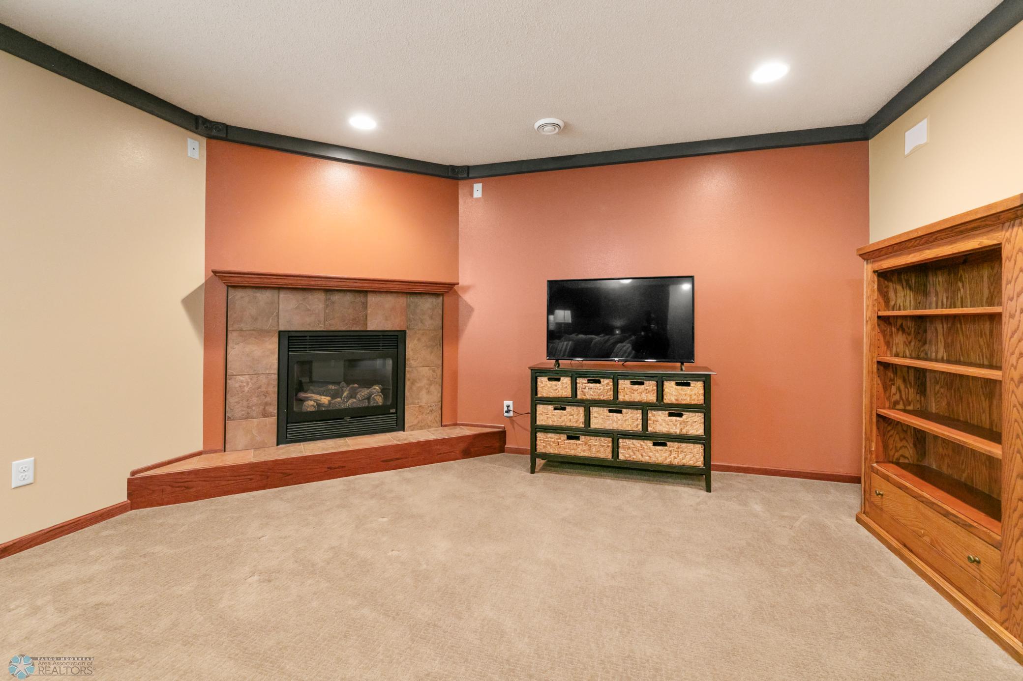 Family Room view 2- Tile surround/gas FP