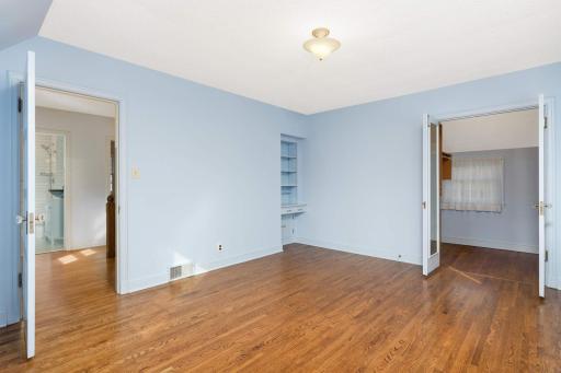 The Master Bedroom Features Built-Ins and an Oversized Walk-In Closet