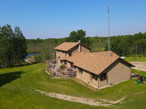 LARGE YARD TO DECK AND REAR EXTERIOR OF HOME