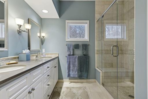 Newer Primary bath; raised counters, double vanity, and a large shower with bench!
