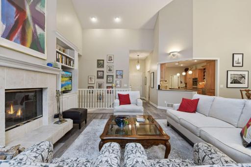 Open floor plan flows nicely for entertaining. Wood burning fireplace with ceramic tile surround and built in shelves and cabinets with ship lap.
