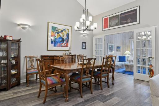 Dining room with chandelier and wall sconces, for your next Holiday dinner.