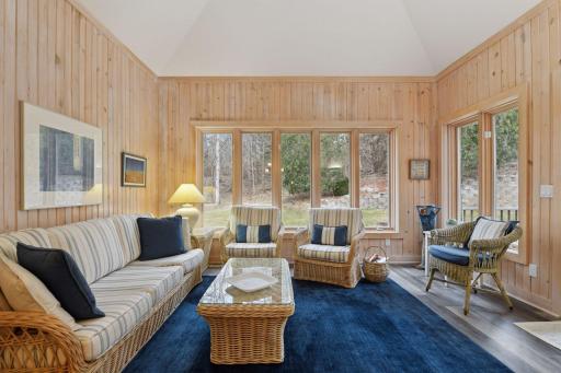 Four season porch wrapped in windows and access to new composite deck!