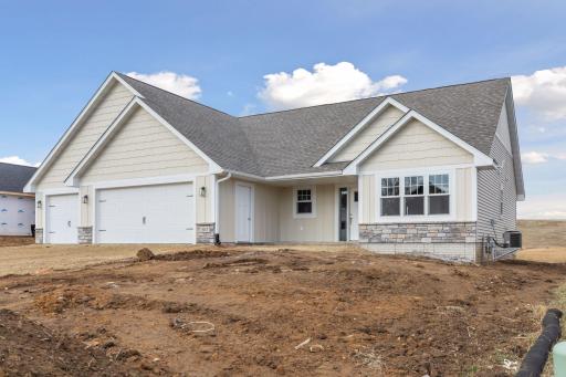 Photos are of a previously completed home with similar design and features. Actual selections, finishes, and materials may vary based on buyer choices and availability.