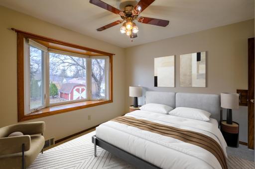 Flexible Bedroom or Dining Room - This main-level room is designated as a bedroom on the floor plan but is commonly used as a formal dining room in this style of 1957 New Hope home. A large bay window provides abundant light. Virtually staged.