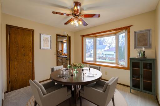Flexible Bedroom or Dining Room - This main-level room is designated as a bedroom on the floor plan but is commonly used as a formal dining room in this style of 1957 New Hope home. A large bay window overlooks the back yard. Virtually staged.