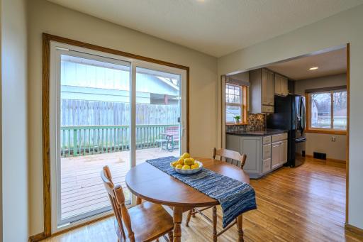 Dining Space Adjacent to Kitchen - Dining area located just off the remodeled kitchen with natural light from the sliding patio door. Open transition supports efficient daily living and easy access to the backyard deck.