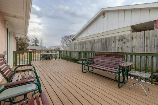 Spacious south-facing deck ideal for relaxing or entertaining, with sliding door access from the home and room for multiple seating areas.