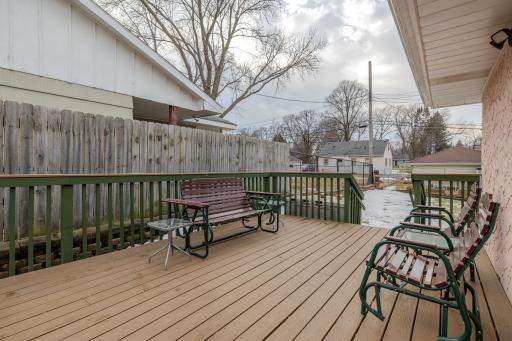 Bright and inviting deck space with ample room for outdoor dining or morning coffee