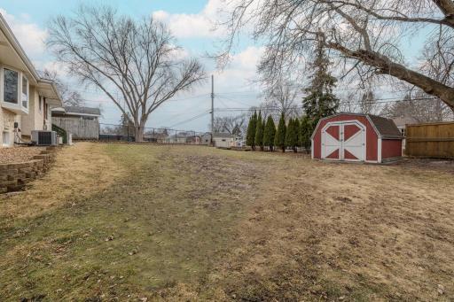 Expansive yard offering space to spread out, with storage shed and open green area ready for your ideas.Expansive yard offering space to spread out, with storage shed and open green area ready for your ideas.