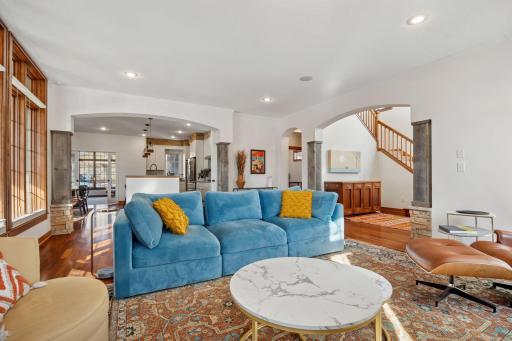 The main level features a spacious open floor plan with a cozy gas fireplace in the living room, seamlessly flowing into the kitchen and dining areas.