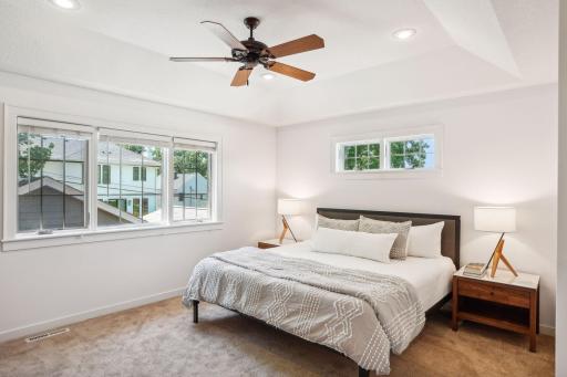 Upstairs, the impressive primary suite includes two walk-in closets and spa-like full bathroom.