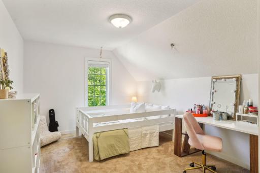 One of two additional bedrooms on the upper level.