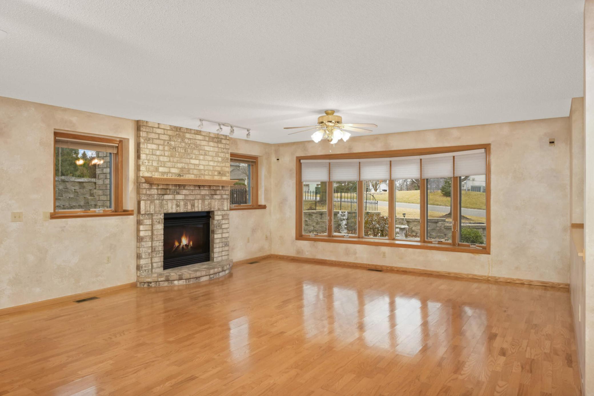 Main Level Living Room w/ Fplc and Lots of Windows