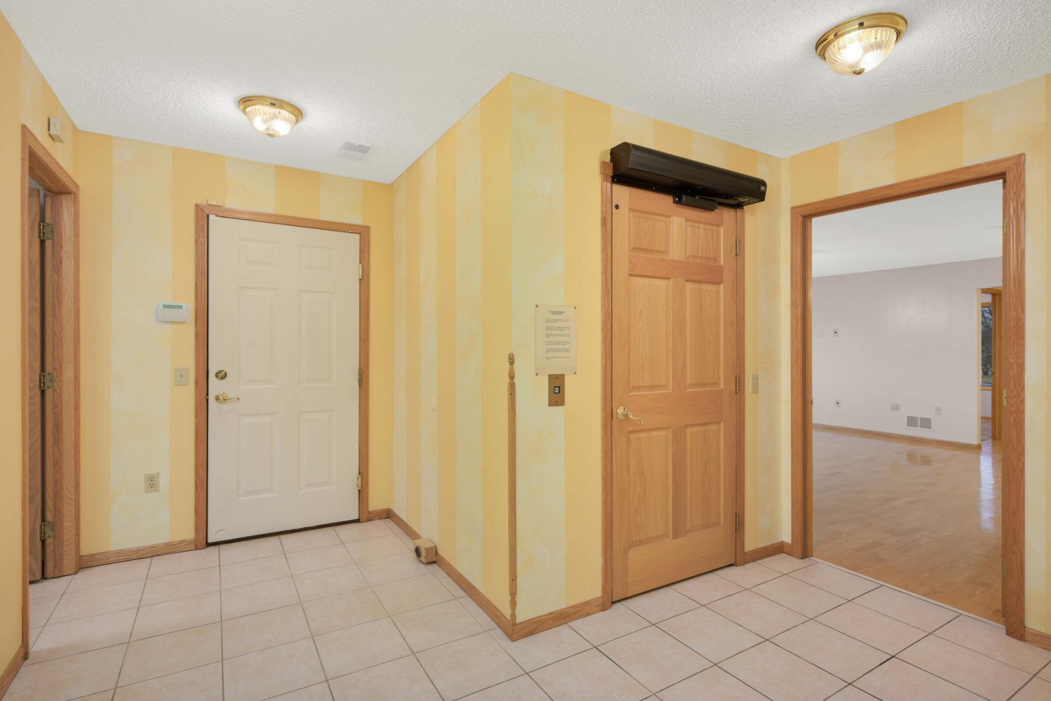 2nd Floor Foyer/Hallway with elevator and entrance to Garage. Floors are level from the Garage and throughout 2nd Level.