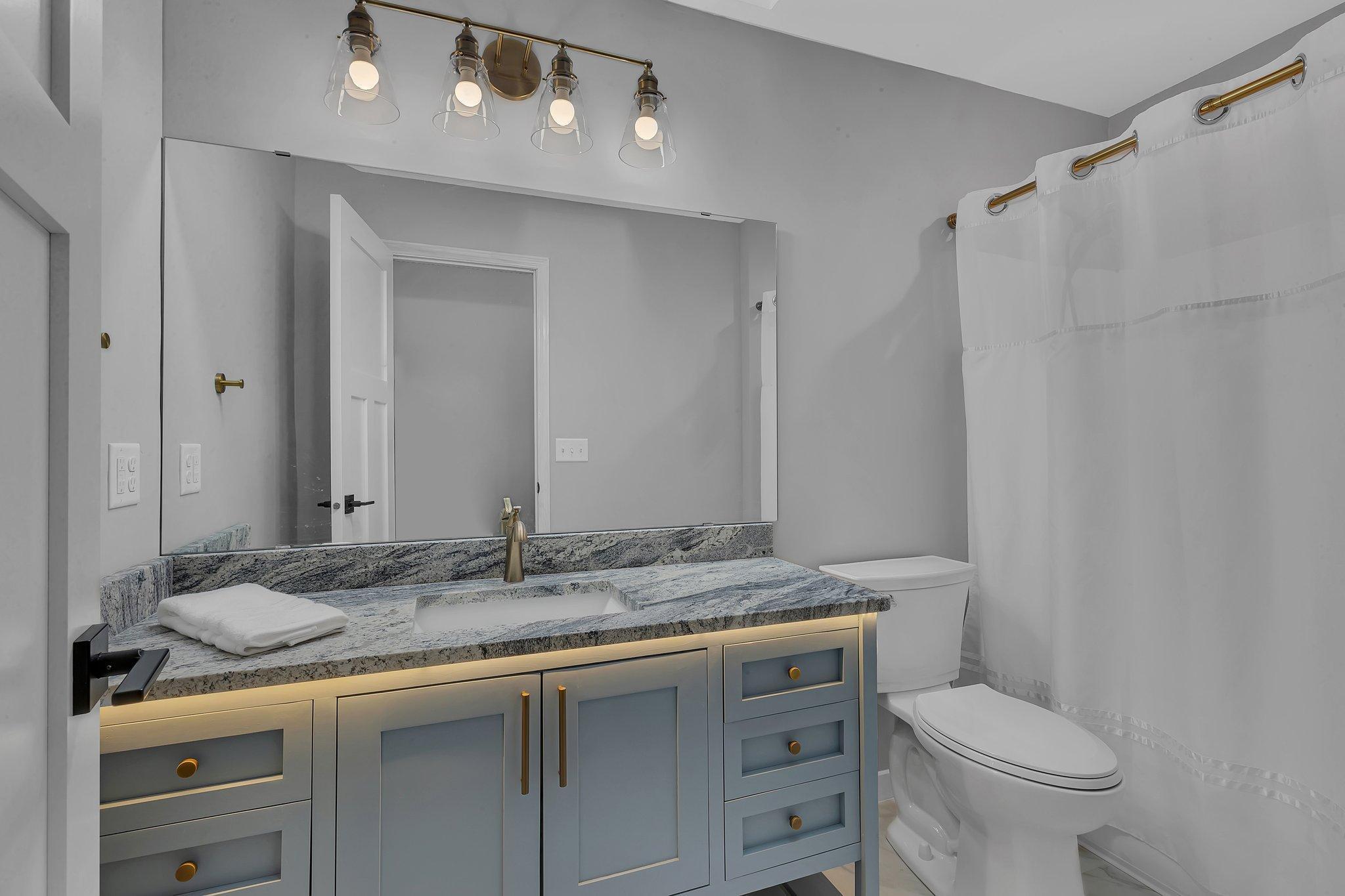 UL Renovated Full Bath with Under Cabinet Lighting and Skylight