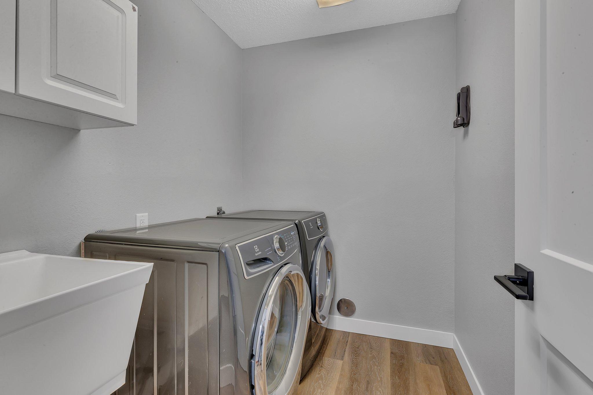 Laundry with New Utility Sink and Light Fixture