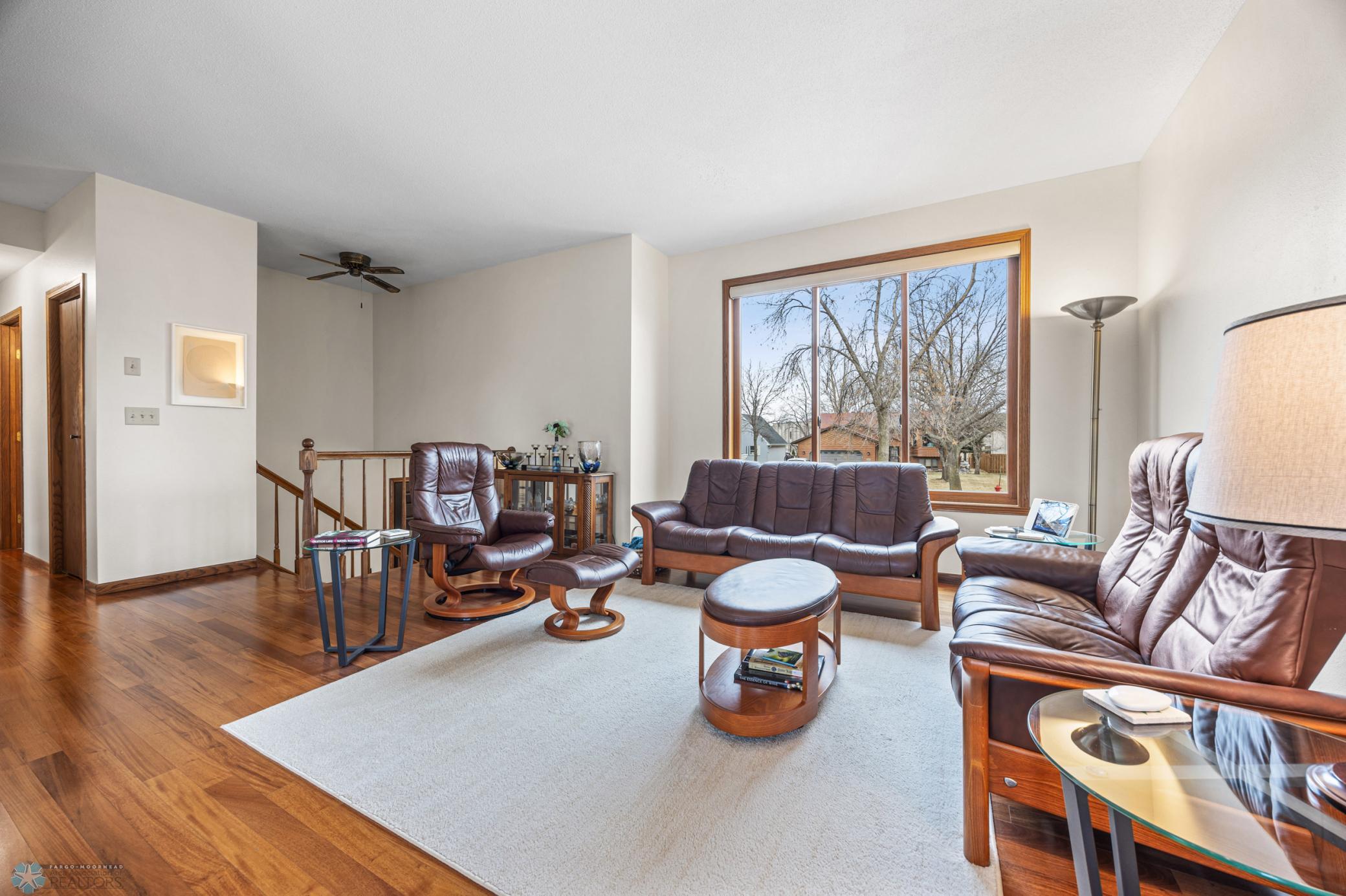 Living Room - with REAL hardwood floors and remote operated window treatments