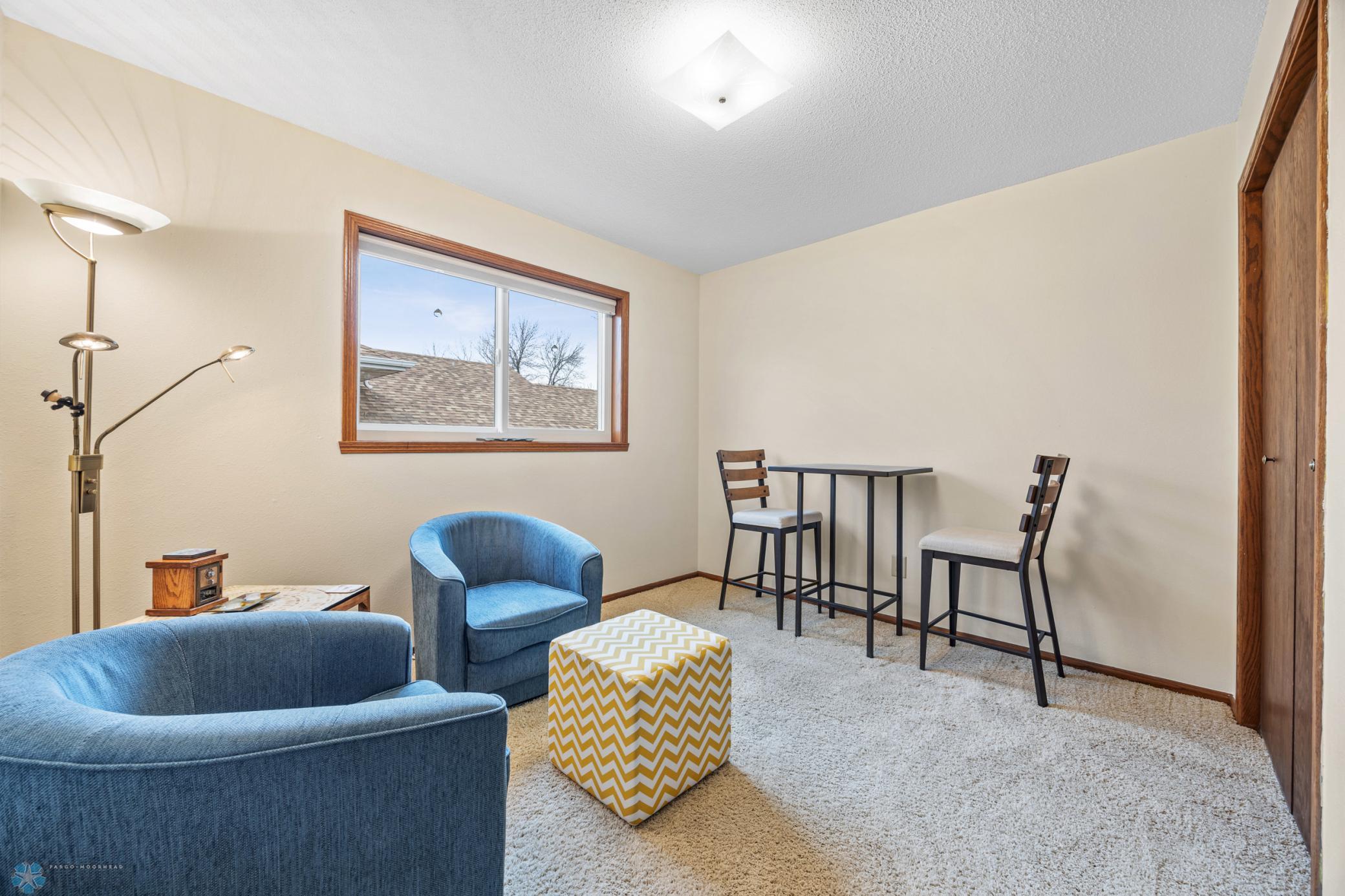2nd Bedroom - currently furnished as a sitting room or den, has East facing window