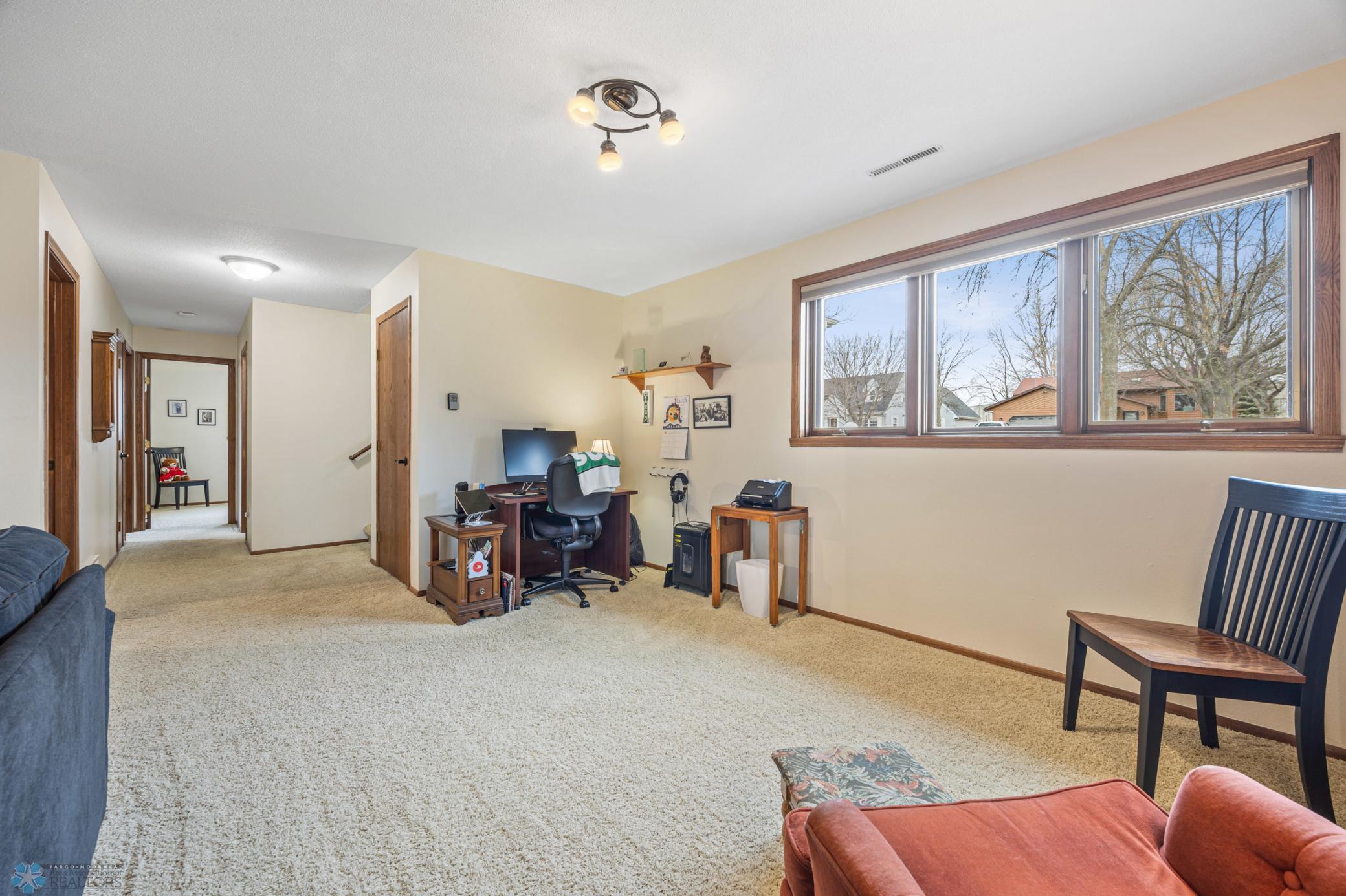Family room - large enough for a separate home office, game table, play area, piano, etc!