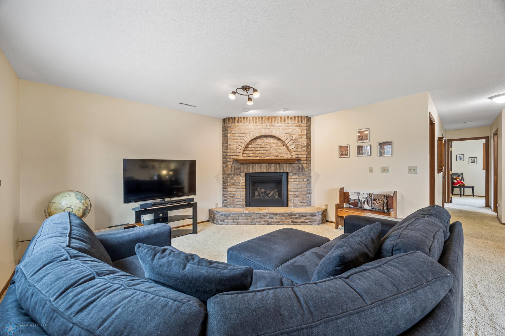 Family room - with a cozy gas fireplace (replaced fireplace gas unit in 2023)