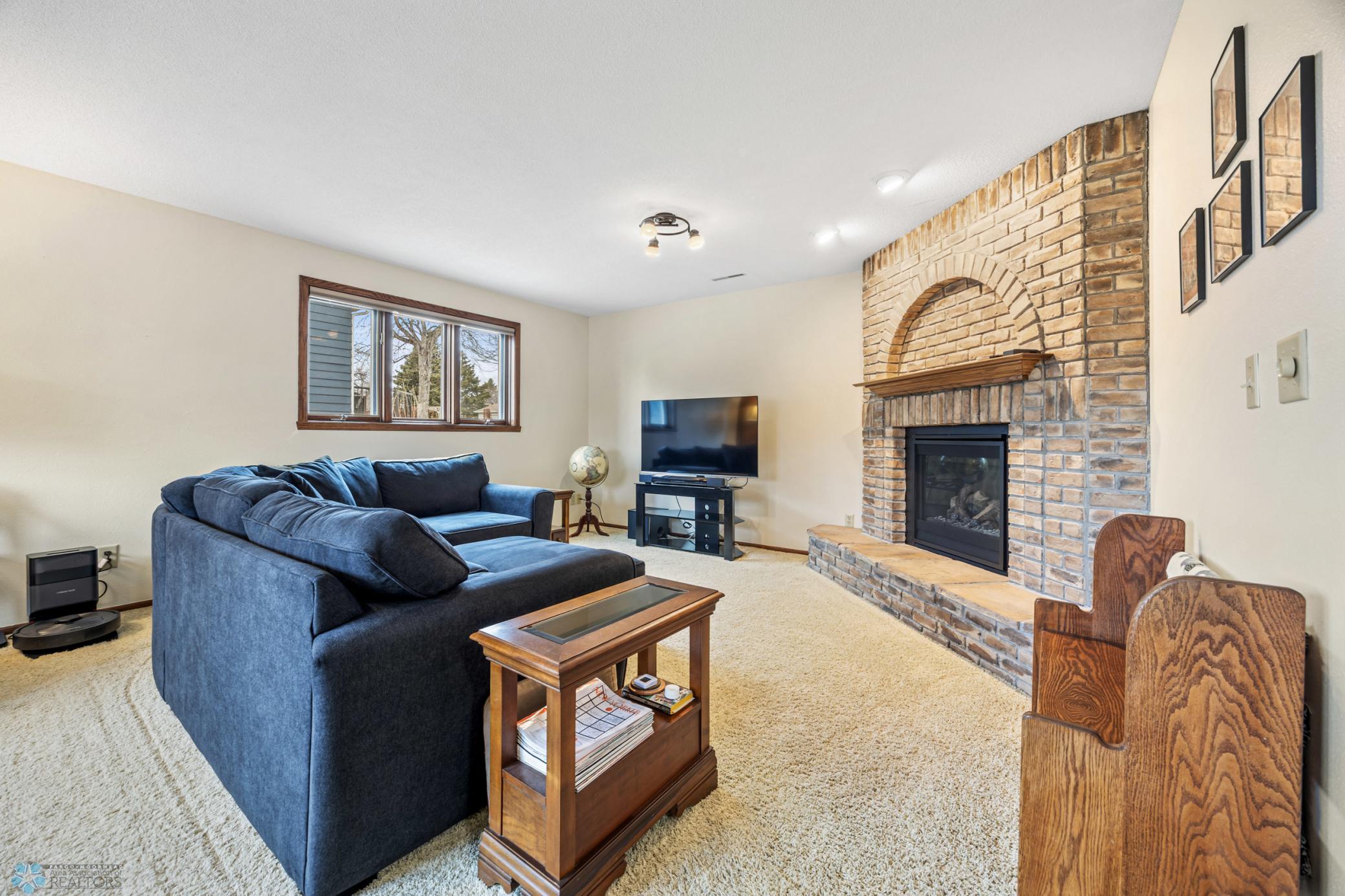 Family room - with a cozy gas fireplace (replaced fireplace gas unit in 2023)