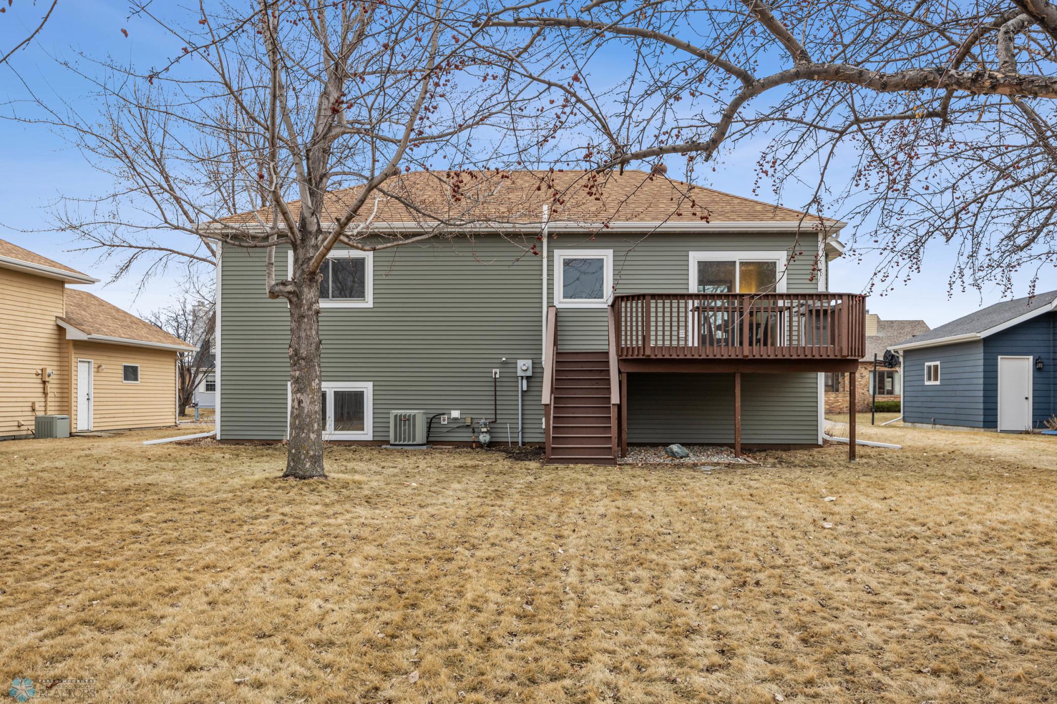 Rear Exterior - mature trees and a spacious yard