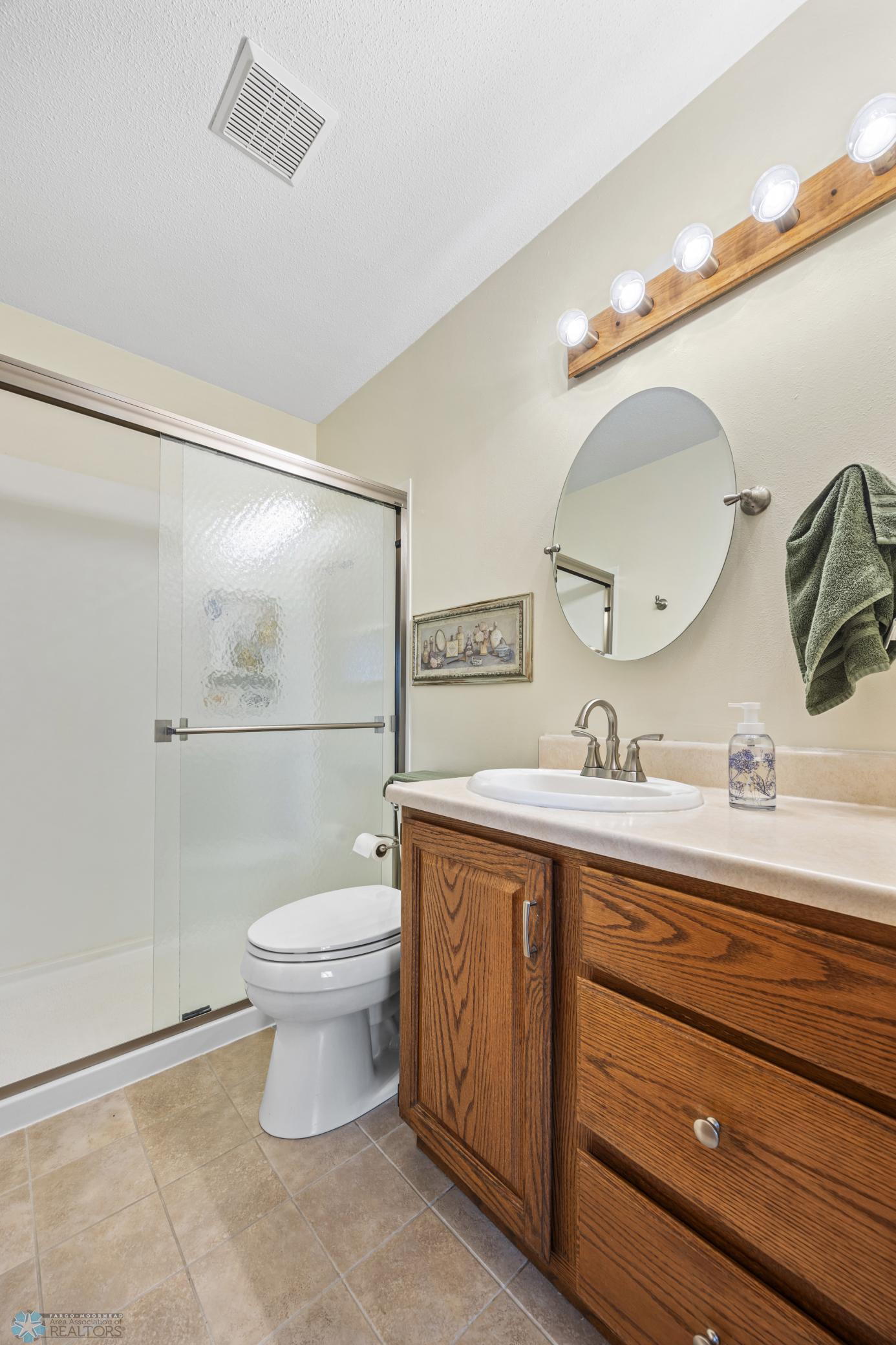 Upper Level 3/4 Bathroom - with step-in shower & tile flooring