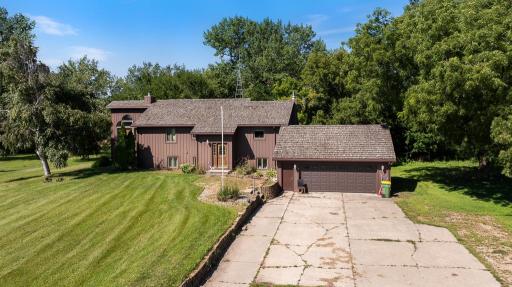 Vertical steel siding and cedar shake shingles offer a unique architectural touch