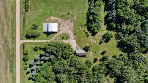 The barn is just a short walk away from the home and a gravel roundabout driveway ensures easy access to the buildings