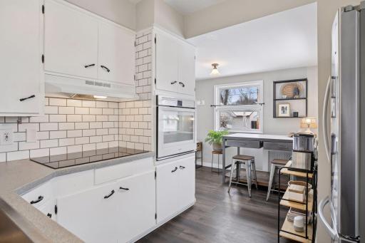 Main level kitchen with crisp white tile backsplash