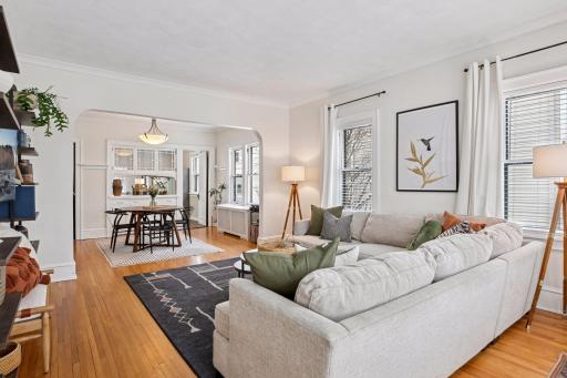 Main level living room with gleaming hardwood floors