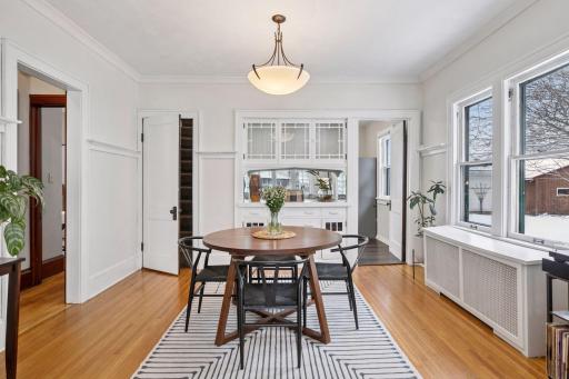 Main level dining room with a pass through window to the kitchen