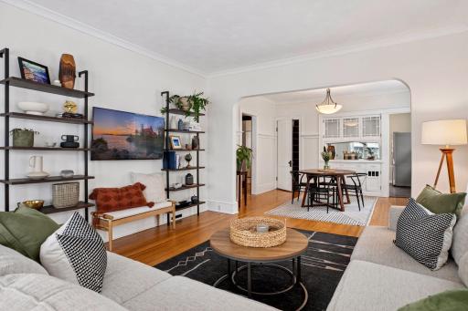 Main level living room with elegant crown molding