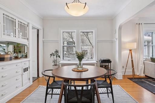 Main level dining room with chair rail molding and ample natural light