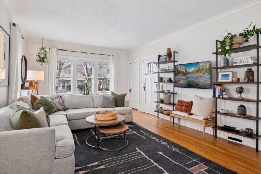 Main level living room filled with natural light from the surrounding windows