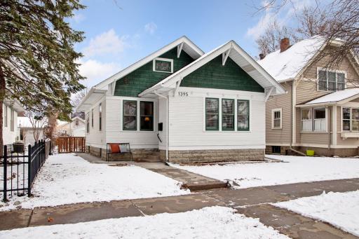 Spacious front yard with multiple surrounding trees providing natural shade