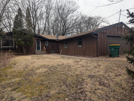 Detached garage sits in front of the house