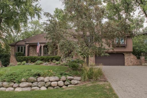 Photo for 11545 39th Avenue N, Minneapolis, MN 55441 - listing #6688789 Front view showing the professional landscaping