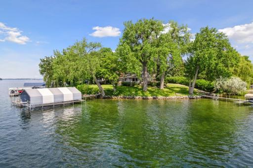 Rare opportunity to own a slice of heaven - a peninsula setting with incredible views on Lake Minnetonka!