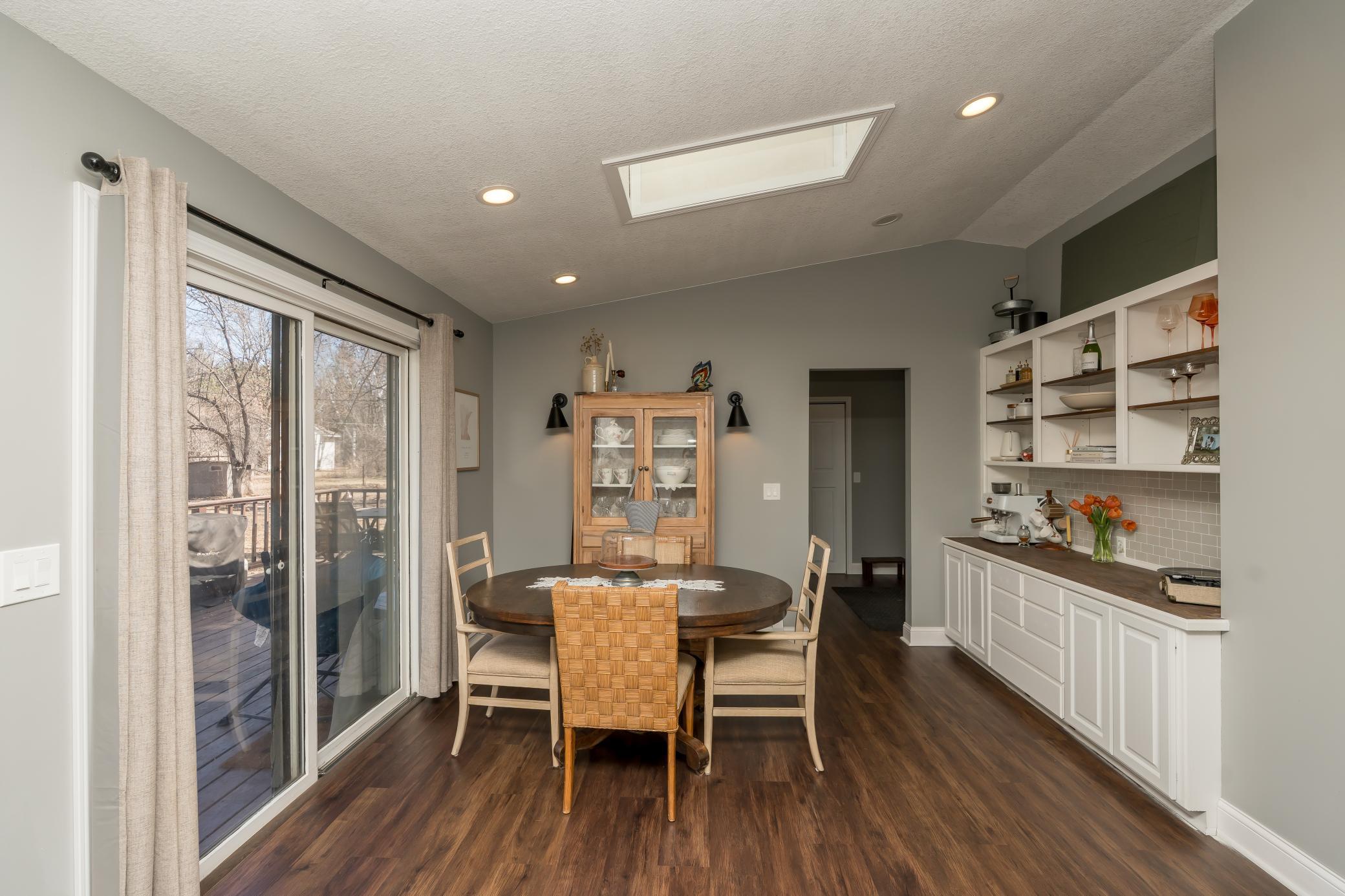 Kitchen/dining area which offers built-ins for storage, coffee bar, and additional pantry space