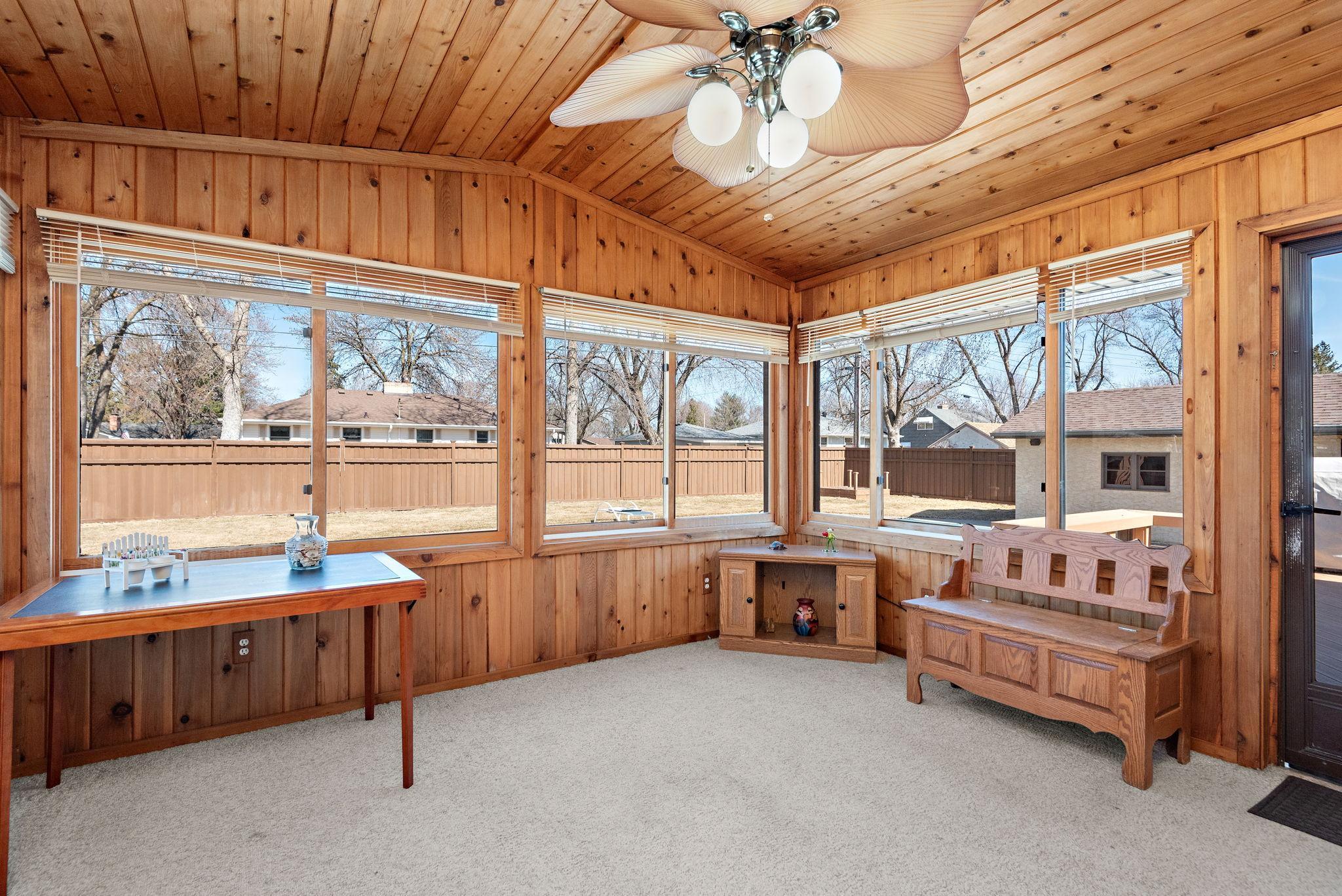 3-season with 3 walls of windows brings in tons of natural light and great views of private fenced in yard.