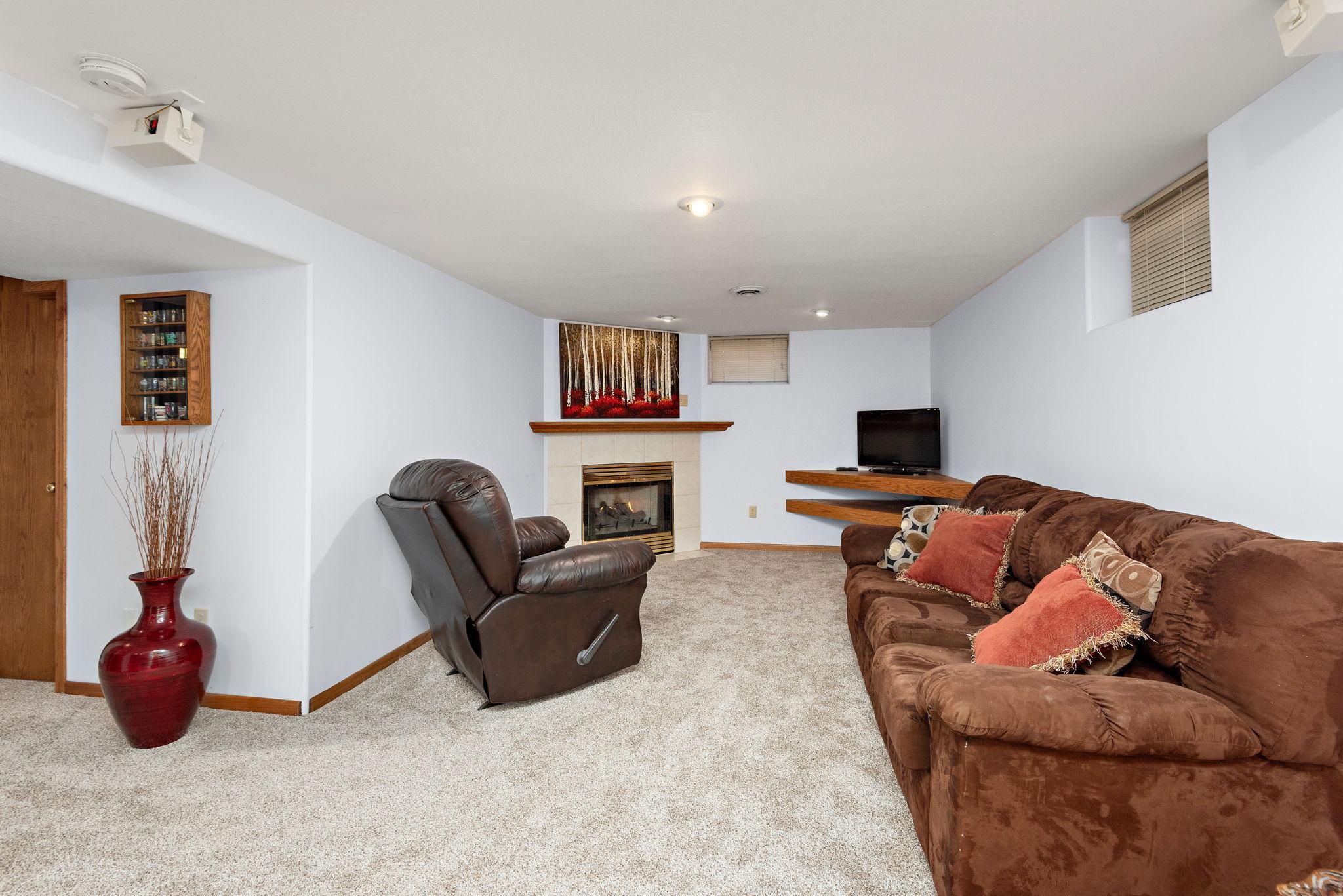 Awesome lower level provides a great space to entertain in front of the cozy gas FPL!