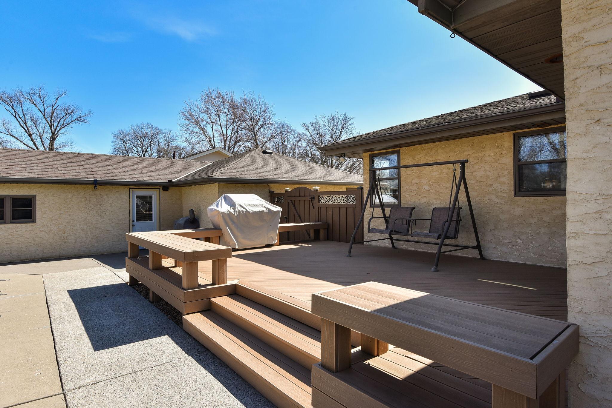 Sprawl out on the extensive maintenance free decking with built-in benches.
